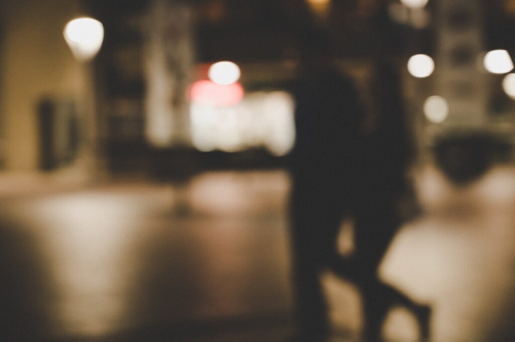 blur image of a couple walking in the street