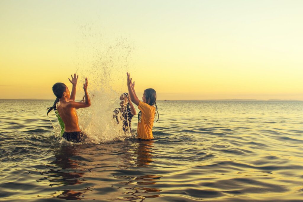 group of people playing on the beach